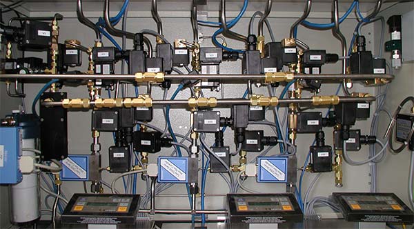 Gas control of a canister loading station for 3 canisters.