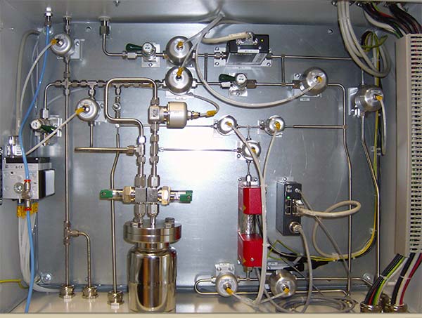 System for liquid flow control of HMDSO with subsequent flash vaporization – without carrier gas.